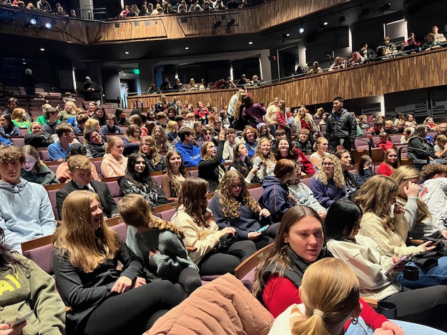 Students wait anxiously for the play to begin